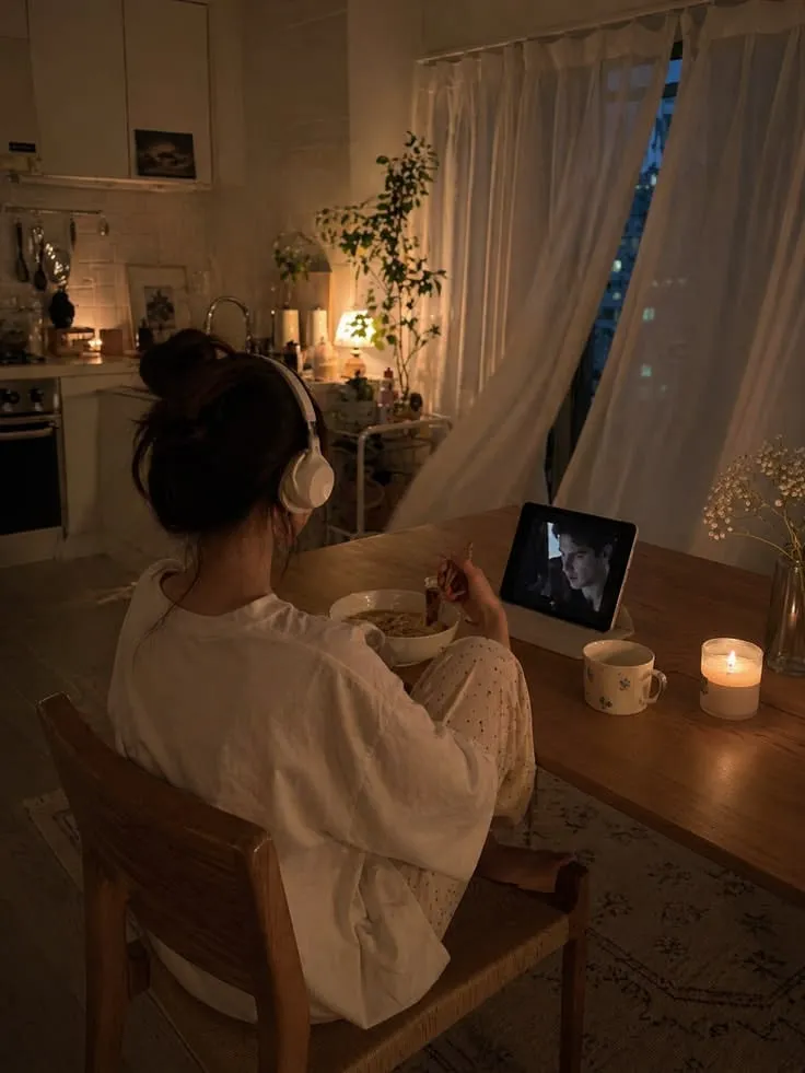 Organized desk with journal and soft lamp glow